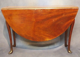 A Georgian mahogany oval drop flap gateleg dining table, raised on cabriole supports 44"