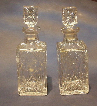 A pair of cut glass spirit decanters and stoppers