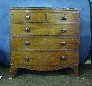 A Georgian mahogany bow front chest of 2 short and 3 long drawers with crossbanded top, raised on splayed bracket feet 42"