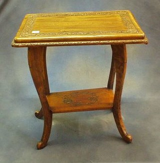 A rectangular carved hardwood 2 tier occasional table on cabriole supports 25" 