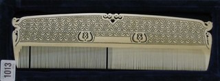 A large Eastern pierced ivory comb 12"