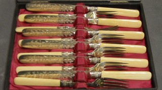 A set of 6 Victorian silver plated fruit knives and forks