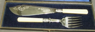 A pair of silver plated fish servers and a set of 6 silver plated fish knives and forks and a childs pusher cased