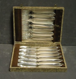 A set of 6 silver plated fish knives and forks cased, 2 sets of chromium plated fruit spoons cased and a set of 6 pastry forks cased