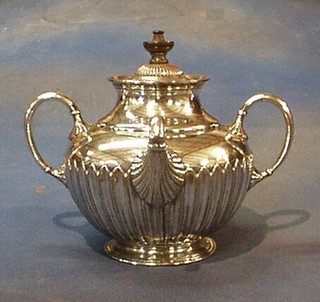 A Britannia metal Royles Patent self pouring teapot with demi-reeded decoration by James Dixon & Sons