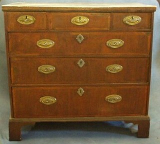 A 19th Century oak and mahogany Country chest of 2 short and 3 long drawers, the drawers with feather banding, raised on bracket feet 39"