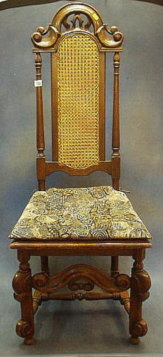 A pair of Victorian Carolean style oak high back chairs with woven rush seats and backs