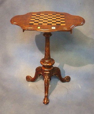 A Victorian shaped figured walnutwood pedestal drop flap chess table fitted 2 drawers and raised on carved pillar and tripod supports 18"