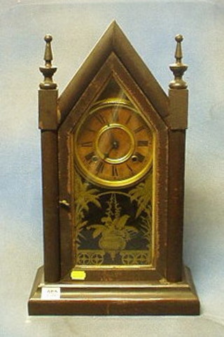 An American striking 8 day shelf clock contained in a walnutwood case with glazed panelled door