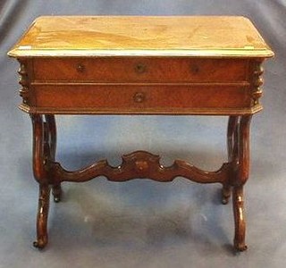 A 19th Century French walnutwood rectangular work table fitted 2 drawers, raised on pierced standard end supports united by an H framed stretcher 31"