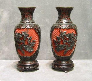 A pair of 20th Century Oriental red lacquered vases and stands 10"