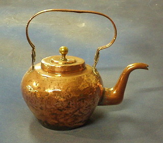 A large copper kettle with swing handle