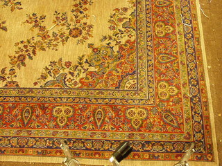 A large machine made Persian style carpet with central medallion 180" x 145"