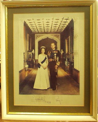 A colour photograph of HM The Queen and Prince Philip signed and dated 1979 12" x 10"