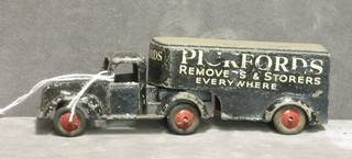 A Timpo toy Pickford's Removals and Storage articulated lorry, a Dinky jeep, a Dinky ambulance, road roller, a Chareens fire engine and 2 motor cars