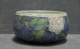 A circular blue glazed Royal Doulton bowl decorated flowers, base impressed 7816LB 4"