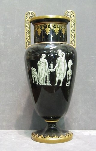 A 19th/20th Century black glazed "Jackville" twin handled vase decorated classical figures 12"