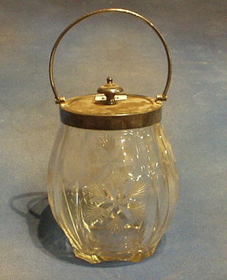A cut glass biscuit barrel with silver plated mounts 7"