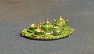 A Continental green glazed porcelain 6 piece miniature tea service comprising oval tray, teapot, cream jug, lidded sucrier, 2 cups and saucers