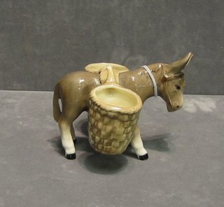 A Sylvac figure of a donkey with 2 paniers 4"