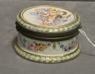 A circular porcelain trinket box, the lid decorated cherubs 3"