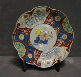 A pair of 19th Century Japanese Imari porcelain bowls with lobed borders and panel decoration 8"