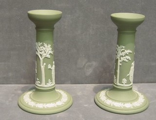 A pair of green Wedgwood jasperware candlesticks, base impressed Wedgwood 65, 7"