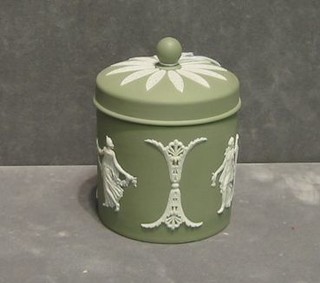 A circular green Wedgwood jasperware jar and cover, base impressed Wedgwood 63, 4"