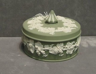 A circular  green Wedgwood jasperware jar and cover, base impressed 61, 5"