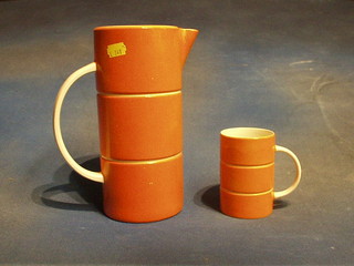 A Beswick orange glazed jug, the base marked Beswick England and incised 1218 and a matching tankard, incised 1226