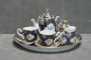 A childs reproduction porcelain tea service