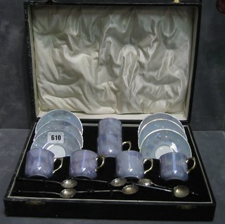 A German 6 piece blue lustre and gilt banded coffee service with 6 silver bean end coffee spoons, cased