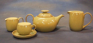 A 59 piece Denby Coloroll  dinner/tea service comprising 12" rectangular casserole dish, 2 8" circular tureen and covers, teapot, coffee pot, cream and milk jug, 2 kitchen storage jars and covers, 6 10" dinner plates, 6 9" side plates, 8 7" cereal bowls, butter dish and stand, twin lipped sauce boat and stand, 6, 6 1/2" tea plates, 8 cups and saucers and 4 mugs