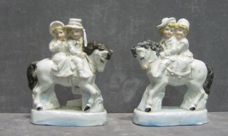 A pair of 19th Century porcelain figures of children on horse back 5"