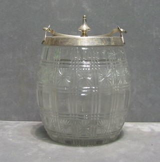 A cut glass biscuit barrel with silver plated top