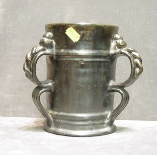 A black glazed 3 handled vase 7"