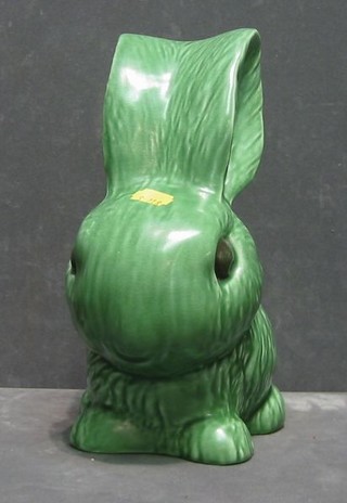 A large green glazed Sylvac figure of a seated rabbit, the base marked Sylvac 1028 10"