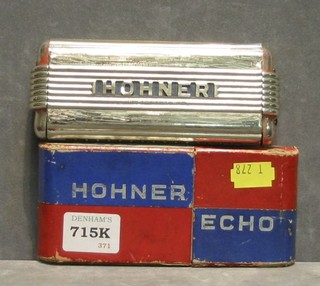 A Hohner Echo mouth organ and 2 porcelain beer pump handles