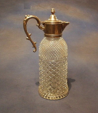 A moulded glass claret jug with silver plated mounts