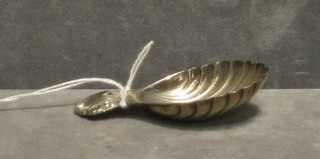 A scallop shaped silver caddy spoon Birmingham 1961