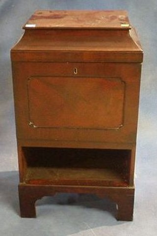 A pair of mahogany pedestal cabinets enclosed by panelled doors and raised on bracket feet 18"