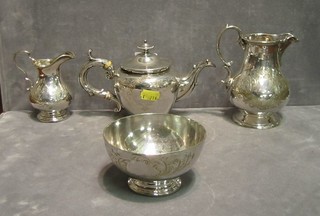 An Edwardian engraved silver plated 4 piece bachelor's tea service comprising teapot, cream jug, milk jug and sugar bowl