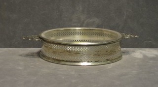 A circular pierced silver twin handled butter dish with cut glass liner, Birmingham 1929 by Mappin & Webb, 2 ozs