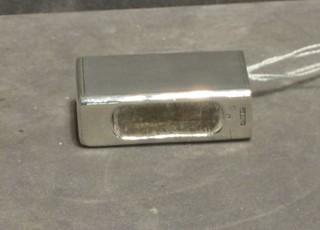 A silver match slip with engine turned decoration