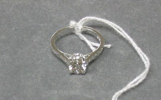A lady's white gold solitaire diamond set engagement ring, the shoulders set 20 diamonds (approx 1.01 ct)