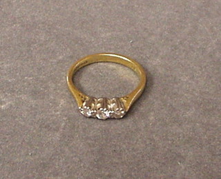 A lady's 18ct gold dress ring set 3 diamonds