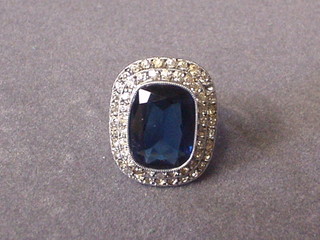 A lady's costume dress ring set a large blue stone