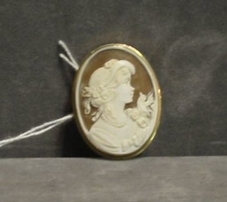 A shell carved cameo brooch contained in a gold mount