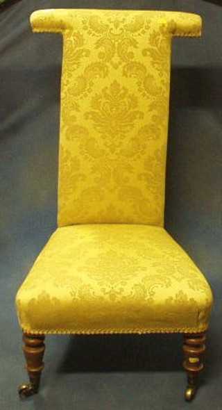 A Victorian walnutwood framed Pre-Dieu chair upholstered in yellow material
