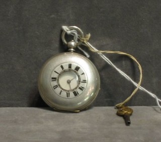 A small demi-hunter pocket watch contained in a Continental silver case